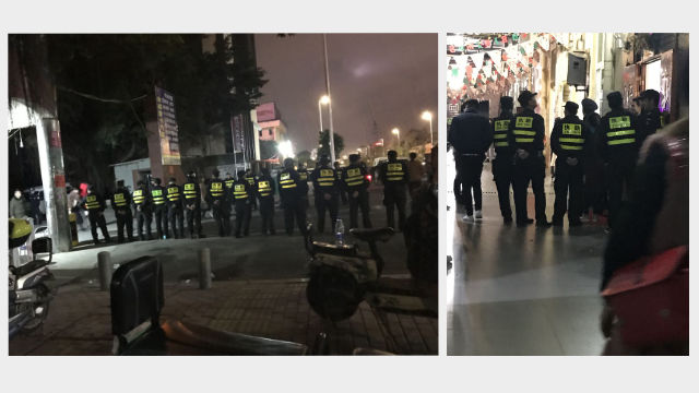 I poliziotti di guardia all’esterno della Haiyan Catholic Prayer Hall impediscono ai fedeli di entrare