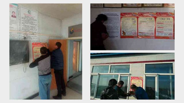 Dipendenti governativi incollano manifesti contro la religione sul muro