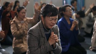 Credenti in una chiesa di casa